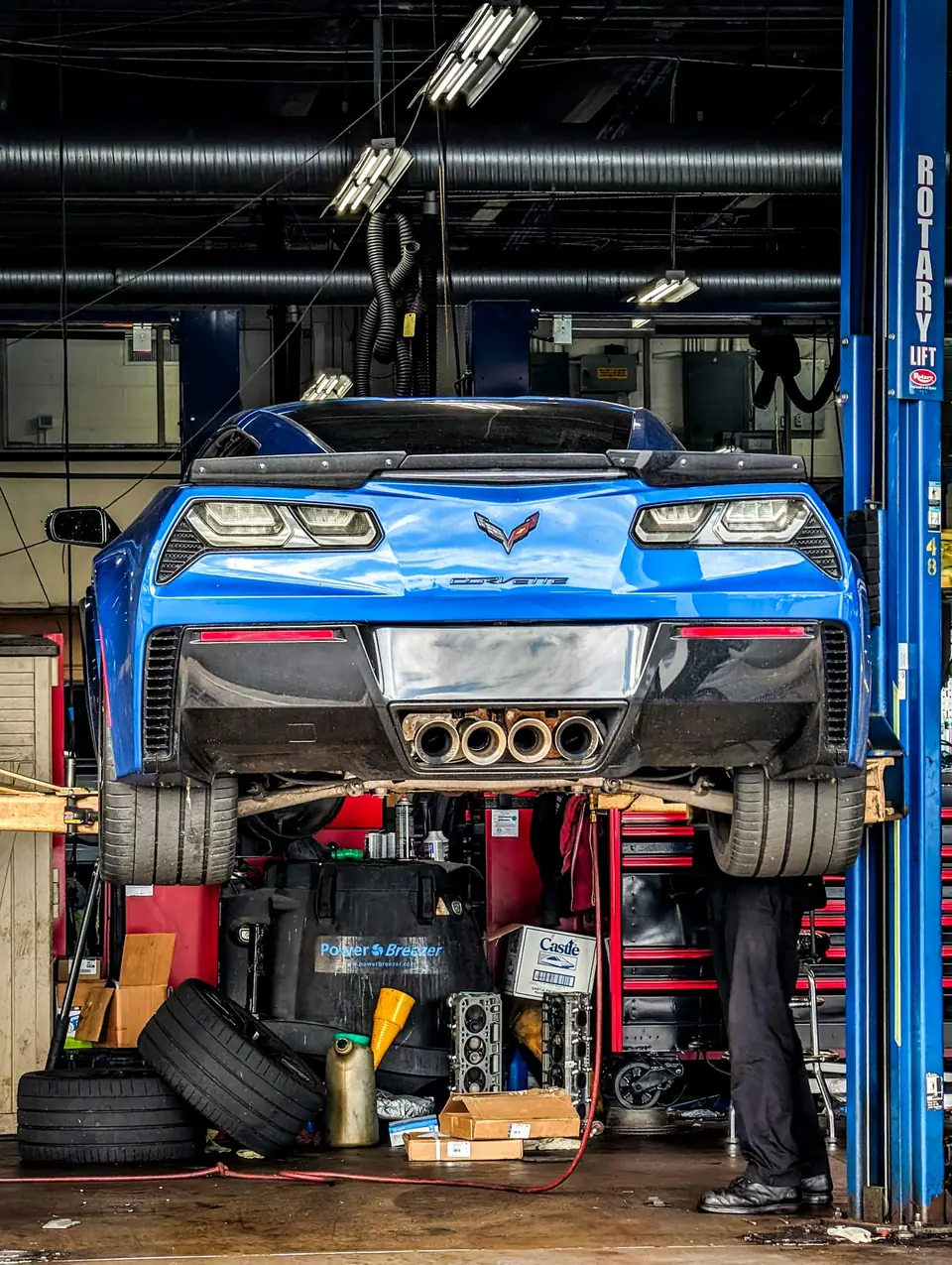 Car on a lift in a repair shop (stock photo)